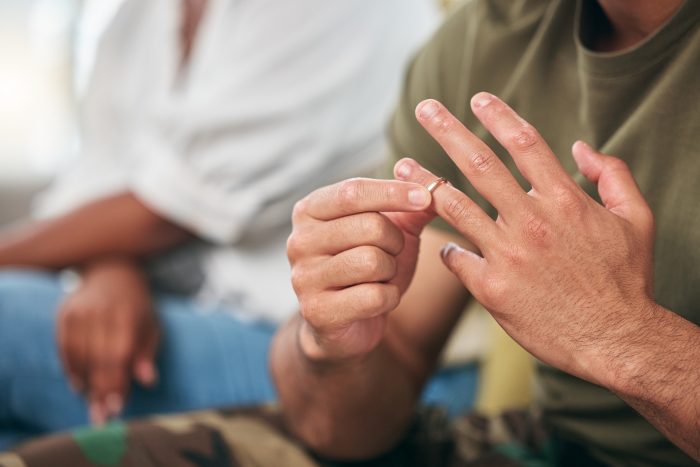 close up of wedding ring being removed